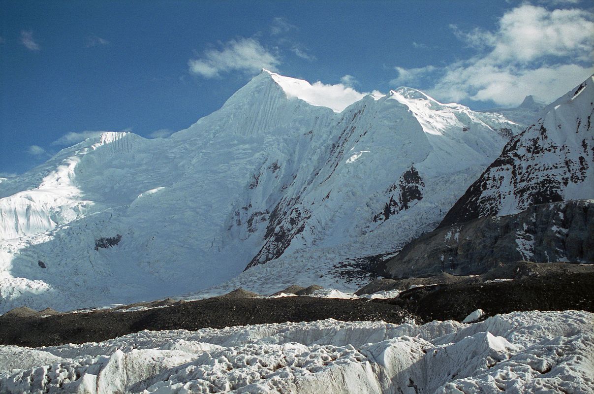 13 Chogolisa Late Afternoon From Shagring Camp On Upper Baltoro Glacier Chogolisa (7665m) is a high snow peak with a distinctive long, almost level summit ridge. Chogolisa I (7665m) is the southwest summit on the left. The slightly lower northeast summit Chogolisa II (7654m) was named Bride Peak by Sir Martin Conway in 1892.